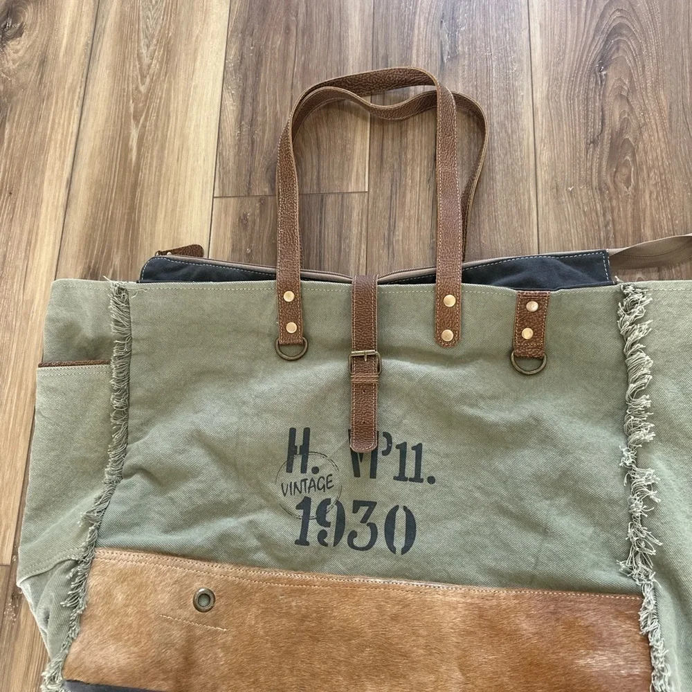 Myra Bag upcycled canvas & cowhide weekender bag